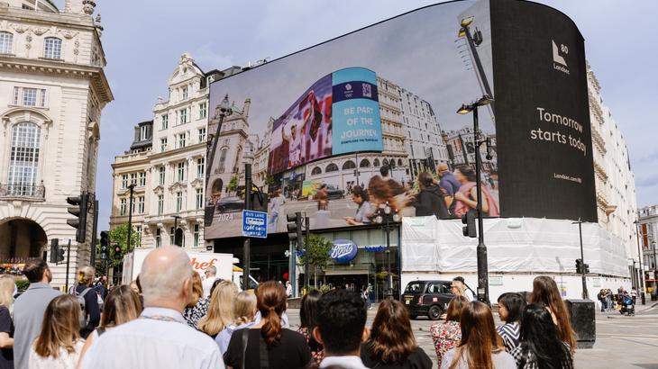 people in crowd outside Piccadily Lights