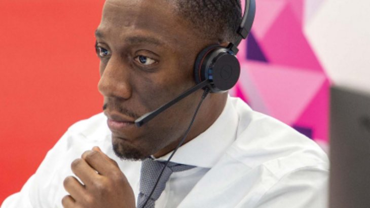 Man with headset assisting Aspire