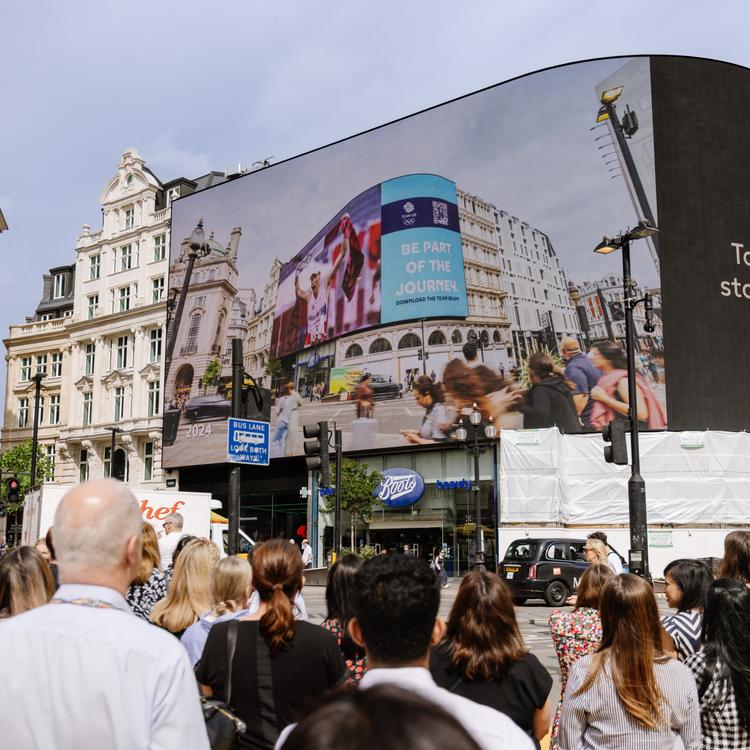 people in crowd outside Piccadily Lights